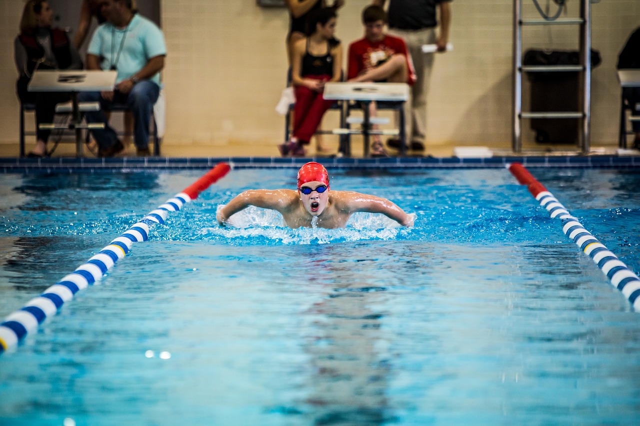 What Age Should a Child Start Swim Lessons? Swimmer training in an indoor pool of the kind used for swim lessons